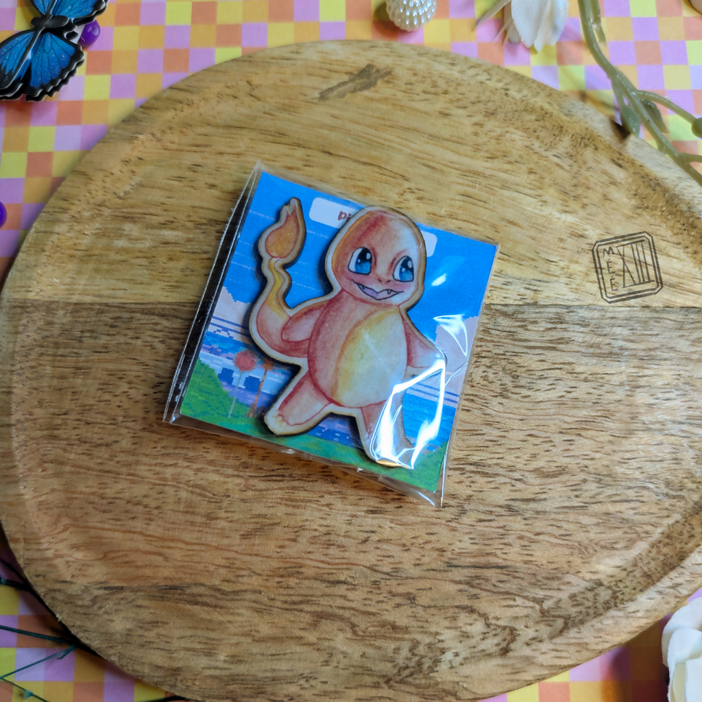 Pin's petit monstre orange