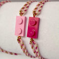 Bracelet ajustable cordon tressé rose dégradé