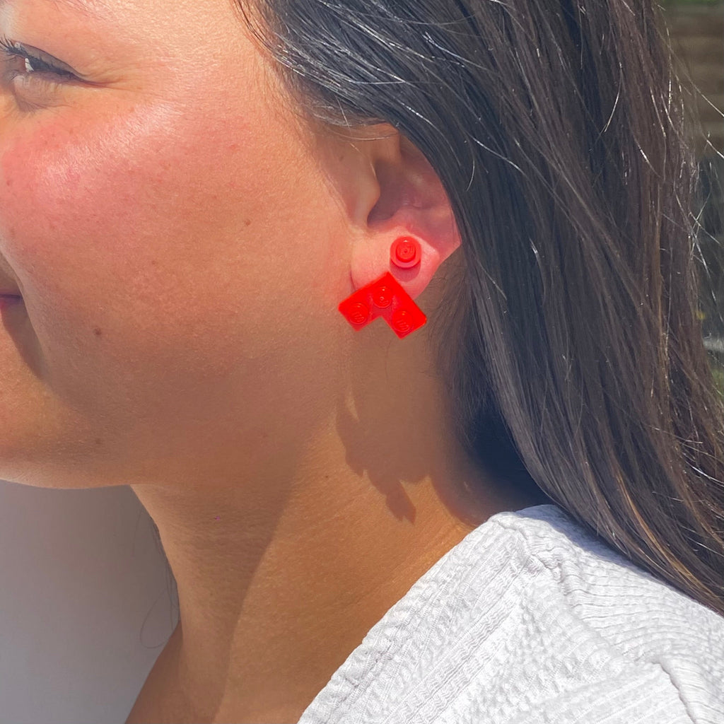 Puces d'oreille avec une brique Lego ronde