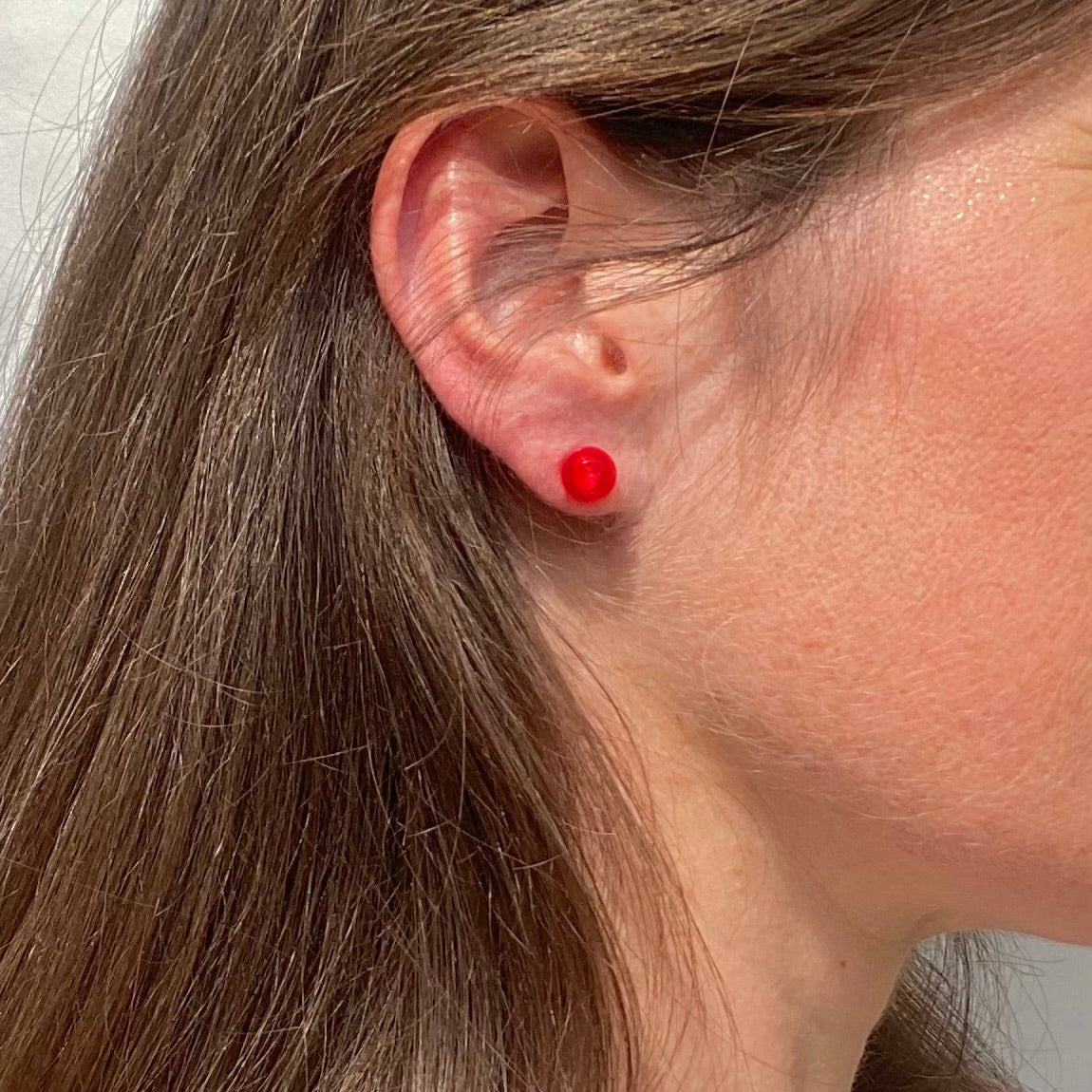 Puces d'oreille avec une brique Lego ronde