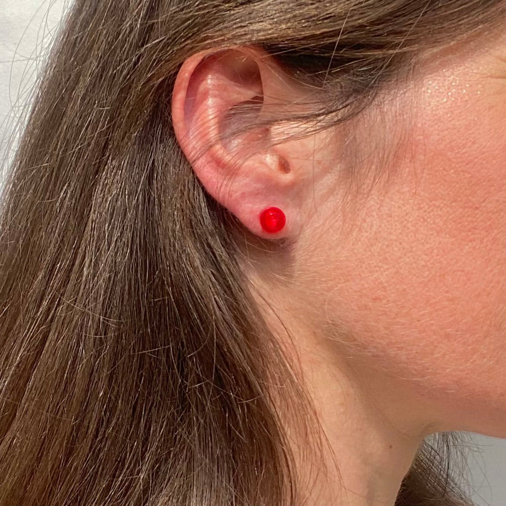 Puces d'oreille avec une brique Lego ronde
